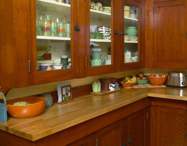 https://www.oldhouseonline.com/oho-html/wp-content/uploads/sites/2/2021/06/a-pantry-cabinet-within-a-bungalow-kitchen-photo-courtesy-of-eric-roth.jpg