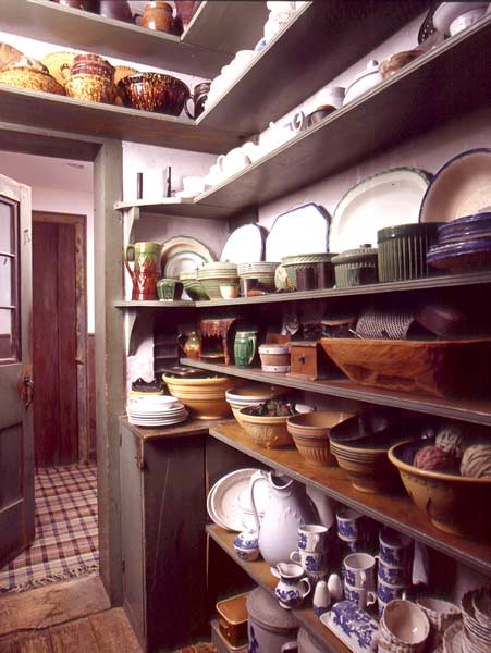 Victorian period organised pantry interior with old antique storage  stoneware jars